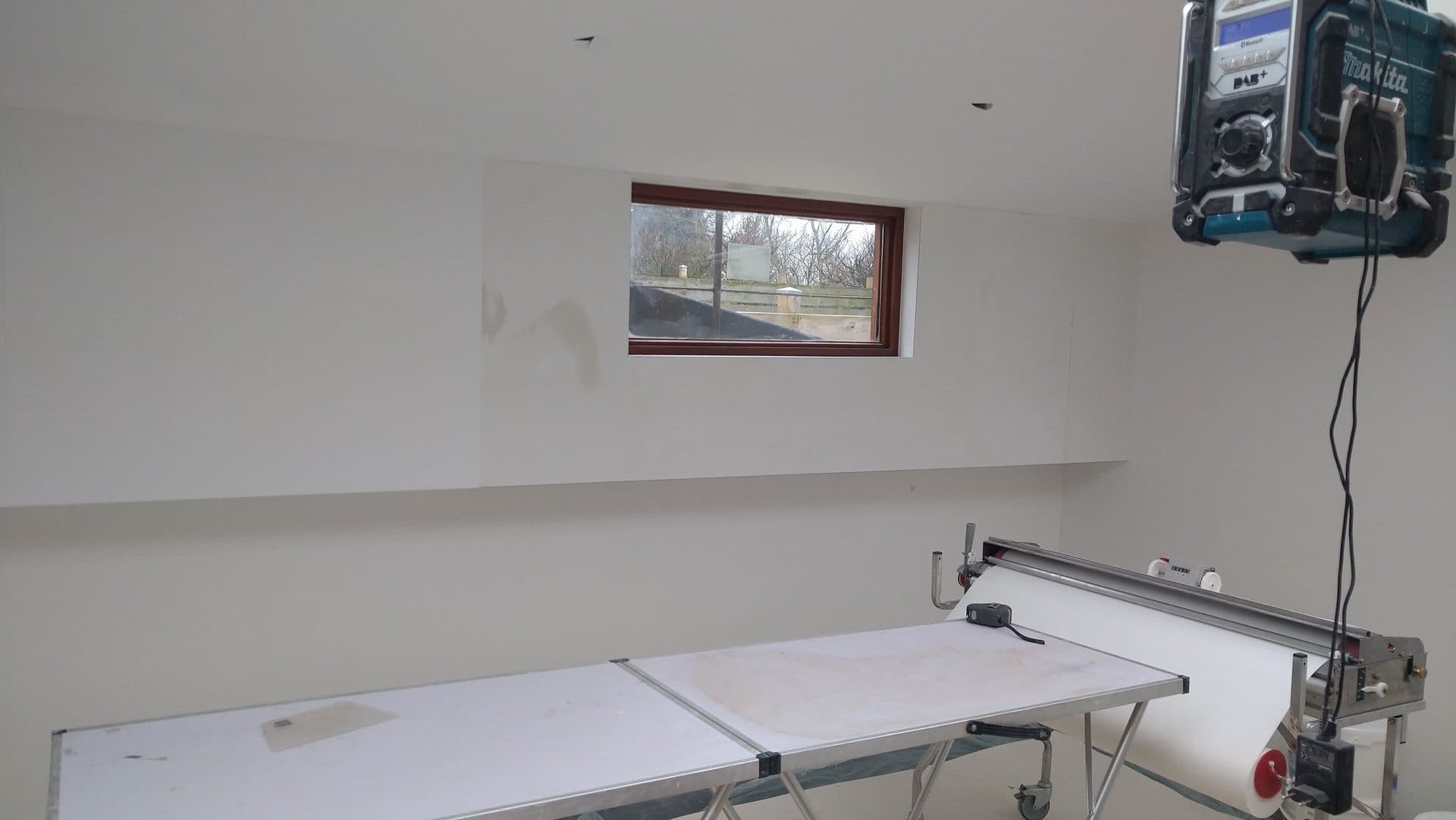 Buitenschilderwerk in aanbouw